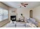 Spacious living room boasts a fireplace, comfortable couches, and an open layout for easy entertaining at 1691 Scenic Pines Dr, Lawrenceville, GA 30044
