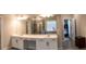 Bright bathroom with double vanity, walk-in shower and tiled floor at 4685 Columbia St, Cumming, GA 30040