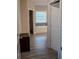Bathroom with tiled floor and a bathtub under a large window at 4685 Columbia St, Cumming, GA 30040