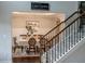 Inviting dining room area with wood floors, elegant table set with chairs, next to a staircase at 4685 Columbia St, Cumming, GA 30040