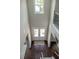 Bright foyer featuring a soaring ceiling, double doors, dark wood floors, and elegant staircase at 4685 Columbia St, Cumming, GA 30040