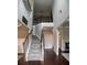 Inviting foyer featuring high ceilings, elegant staircase with wooden rails, and hardwood floors at 4685 Columbia St, Cumming, GA 30040