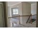 This second story hallway overlooks the main floor and offers access to several rooms at 4685 Columbia St, Cumming, GA 30040