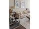 Close-up of a stylish living room featuring a neutral sofa, unique decor, and a cozy atmosphere at 4685 Columbia St, Cumming, GA 30040