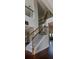 This home's staircase features a wrought iron railing and hardwood details at 4685 Columbia St, Cumming, GA 30040