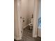 Modern toilet room with gray floors, white walls, and elegant fixtures at 4685 Columbia St, Cumming, GA 30040
