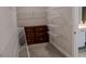 Walk-in closet with wire shelving and a wooden dresser at 4685 Columbia St, Cumming, GA 30040