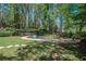 Backyard oasis featuring a stone-lined pool and a patio perfect for outdoor living at 965 River Overlook Ct, Sandy Springs, GA 30328