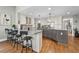 Bright kitchen features granite countertops, stainless steel appliances, and barstool seating at 965 River Overlook Ct, Sandy Springs, GA 30328