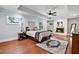 Relaxing main bedroom features a tray ceiling, fireplace, and hardwood floors at 965 River Overlook Ct, Sandy Springs, GA 30328