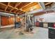 Unfinished basement is outfitted with workout equipment, ample storage, and ready for custom design at 1496 Country Squire Dr, Decatur, GA 30033