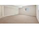 Neutral basement with ample natural light and comfortable carpeting at 1496 Country Squire Dr, Decatur, GA 30033