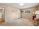 Neutral bedroom with beige walls, plush carpeting, a window with blinds, and a double closet at 1496 Country Squire Dr, Decatur, GA 30033