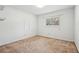 Bright bedroom with a window and neutral carpet at 1496 Country Squire Dr, Decatur, GA 30033