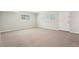 Bright and airy bedroom with neutral walls, plush carpeting, and two large windows at 1496 Country Squire Dr, Decatur, GA 30033