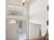 Bright foyer featuring a white front door, neutral walls, and an elegant pendant light fixture at 1496 Country Squire Dr, Decatur, GA 30033