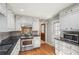 Cozy kitchen with stainless steel oven and stove, stone backsplash, and access to backyard at 1496 Country Squire Dr, Decatur, GA 30033
