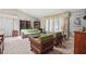 Cozy living room with patterned sofa and chairs, large bright windows, and vintage decor at 1496 Country Squire Dr, Decatur, GA 30033