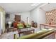 Bright living room with patterned sofa and chairs, vintage decor, and overhead skylight at 1496 Country Squire Dr, Decatur, GA 30033