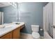 This bathroom features a mirror, sink, and toilet at 625 Outlook Way, Atlanta, GA 30349