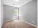 This bedroom is bright with neutral walls and a window at 625 Outlook Way, Atlanta, GA 30349
