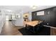 Bright open-concept dining area with adjacent kitchen, modern lighting, and stylish decor at 625 Outlook Way, Atlanta, GA 30349