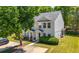 Charming two-story home with well-maintained lawn, mature trees, and a paved driveway leading to the front entrance at 625 Outlook Way, Atlanta, GA 30349