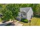 Inviting two-story home with manicured lawn, mature tree, and a paved driveway leading to the front entrance at 625 Outlook Way, Atlanta, GA 30349