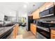 Updated kitchen featuring stainless steel appliances and an open view to the living room at 625 Outlook Way, Atlanta, GA 30349