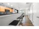 Open concept kitchen with stainless steel appliances and breakfast bar with seating at 625 Outlook Way, Atlanta, GA 30349