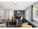 Comfortable living room features a dark accent wall, large TV, and a sectional sofa at 625 Outlook Way, Atlanta, GA 30349