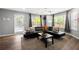 Bright living room with a cozy sectional sofa, decorative pillows, and large windows for ample natural light at 625 Outlook Way, Atlanta, GA 30349