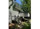 Side view of a backyard deck with stairs descending to a grassy area at 861 Creek Nw Trl, Kennesaw, GA 30144
