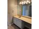 Functional bathroom vanity with ample counter space and storage, complemented by a large mirror and overhead lighting at 861 Creek Nw Trl, Kennesaw, GA 30144
