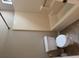 Bathroom area featuring a white toilet and a bathtub with matching wall surround at 861 Creek Nw Trl, Kennesaw, GA 30144