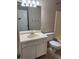 Standard bathroom featuring a vanity, toilet, and combination tub and shower at 861 Creek Nw Trl, Kennesaw, GA 30144