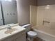 Standard bathroom featuring a vanity, toilet, and combination tub and shower at 861 Creek Nw Trl, Kennesaw, GA 30144