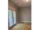 Bedroom featuring gray walls, tile floors, a ceiling light, and windowed French doors at 861 Creek Nw Trl, Kennesaw, GA 30144