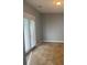 Bedroom featuring gray walls, tile floors, a ceiling light, and windowed French doors at 861 Creek Nw Trl, Kennesaw, GA 30144