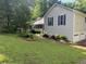 Traditional home with gray siding, green lawn and landscaped beds at 861 Creek Nw Trl, Kennesaw, GA 30144