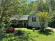 Charming home with a covered front porch and lush landscaping at 861 Creek Nw Trl, Kennesaw, GA 30144