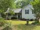 Charming single-Gathering home with covered porch and beautiful landscaped yard with lawn at 861 Creek Nw Trl, Kennesaw, GA 30144
