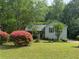 Charming single-Gathering home with well-maintained lawn and beautiful flowering shrubbery at 861 Creek Nw Trl, Kennesaw, GA 30144