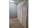Hallway with bi-fold door closet and overhead skylight to provide natural light at 861 Creek Nw Trl, Kennesaw, GA 30144