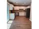 Kitchen with white cabinets, stainless steel appliances, and hardwood floors at 861 Creek Nw Trl, Kennesaw, GA 30144