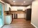 Kitchen with white cabinets, stainless steel appliances, and hardwood floors at 861 Creek Nw Trl, Kennesaw, GA 30144