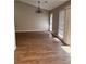 Bright living room featuring hardwood floors, chandelier, and backyard view at 861 Creek Nw Trl, Kennesaw, GA 30144