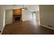 Living room featuring brick fireplace, hardwood floors, and chandelier at 861 Creek Nw Trl, Kennesaw, GA 30144