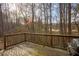 Enjoy the privacy from this back deck overlooking wooded scenery and providing grill at 8664 Spivey Village Trl, Jonesboro, GA 30236