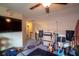 Upstairs bonus room with TV and music equipment including guitars and amplifiers at 8664 Spivey Village Trl, Jonesboro, GA 30236